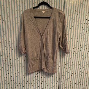 J crew gray cardigan with buttons and roll up sleeves. Has front pockets